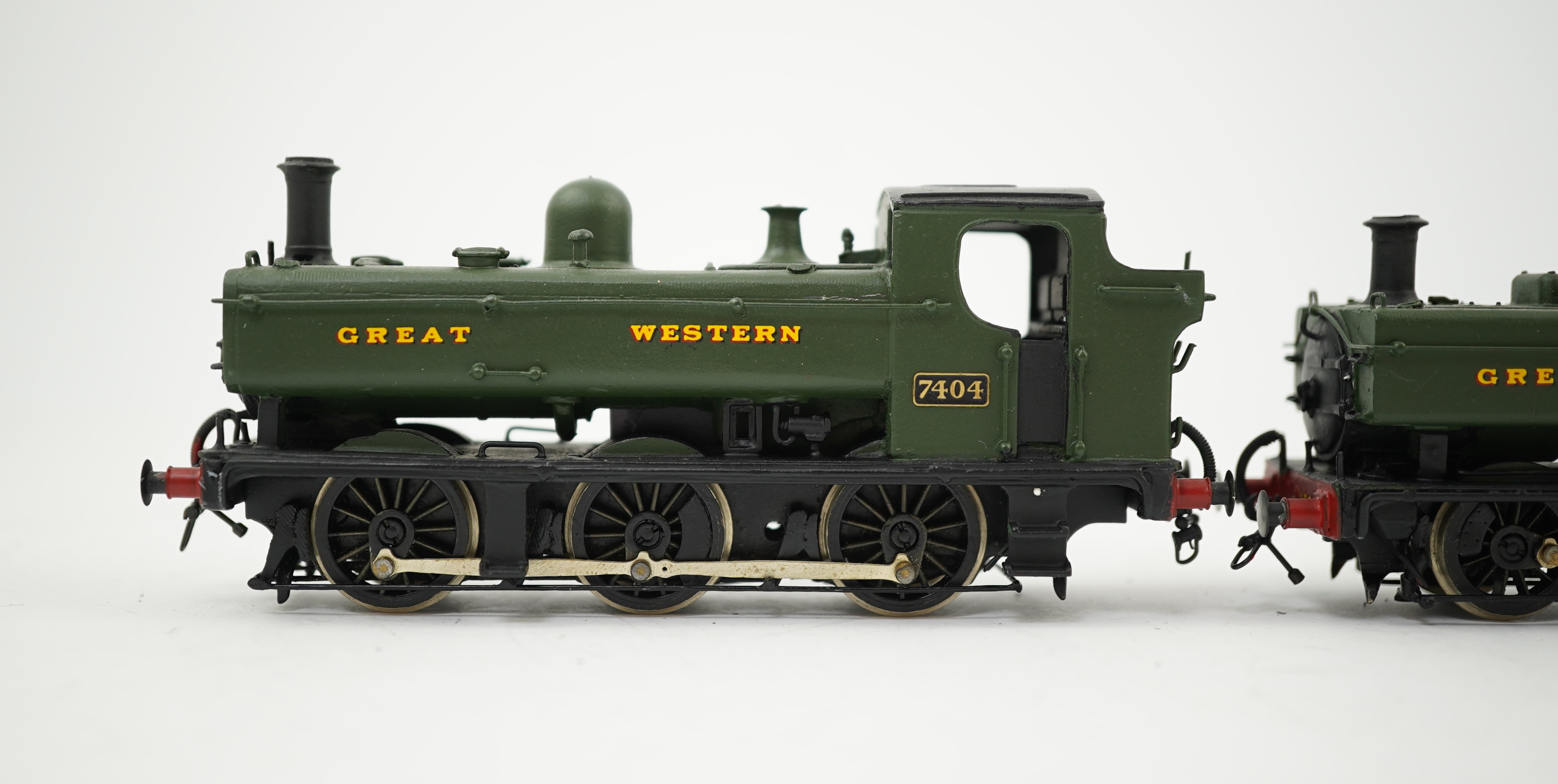 Two 00 gauge brass and white metal kit built GWR Pannier Tank locomotives; a 1600 class 0-6-0PT, 1600, together with an 7400 class 0-6-0PT, 7404, constructed, painted and lined to a high standard, both motored for two ra
